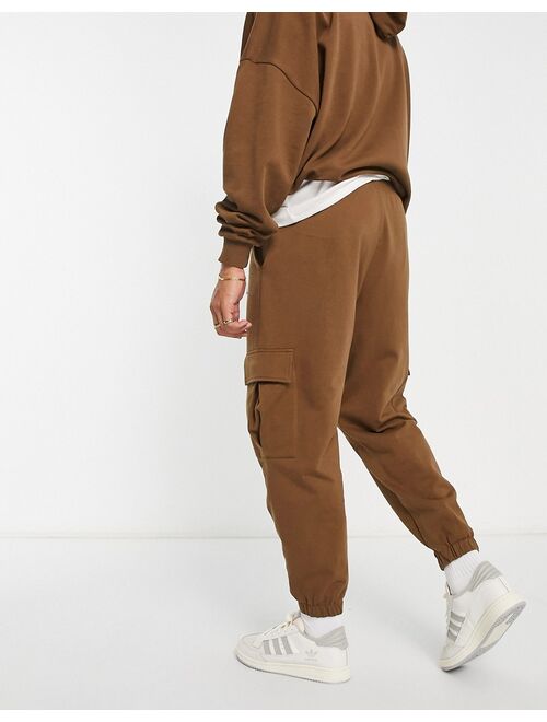 ASOS DESIGN oversized cargo sweatpants in brown