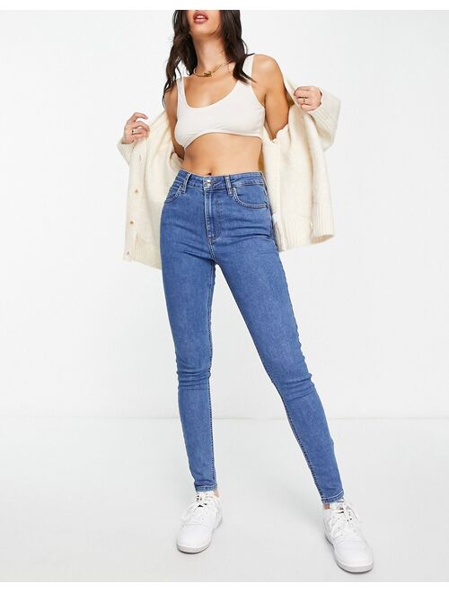 ASOS DESIGN skinny jeans in mid blue