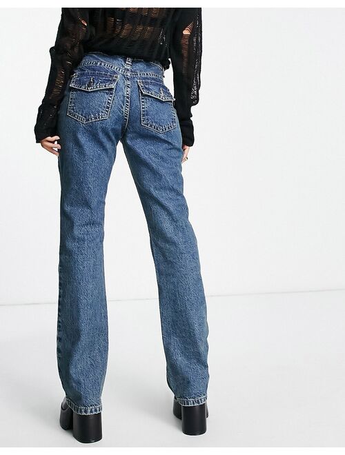 ASOS DESIGN low rise flared jeans with western pocket detail in tinted blue