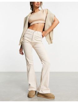 flared jeans in neutral