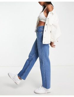 90s straight jean with raw hem in mid blue