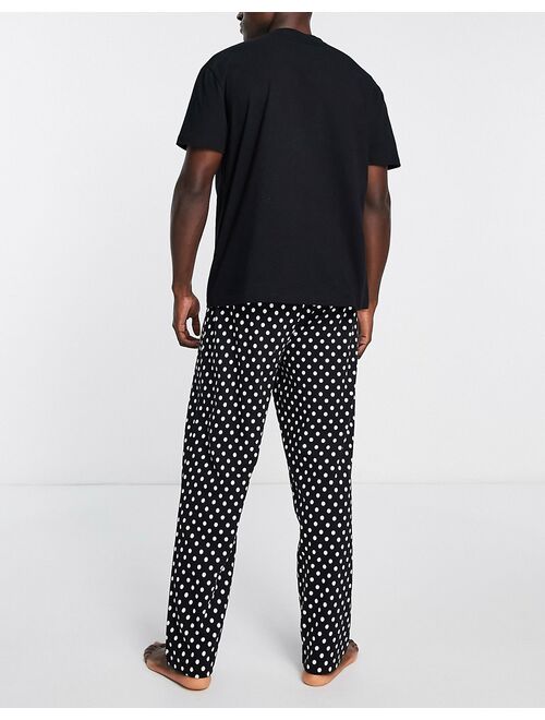 ASOS DESIGN pajama set with T-shirt and pants in black and white spot