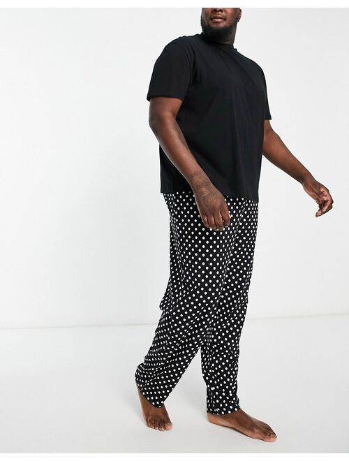 ASOS DESIGN pajama set with T-shirt and pants in black and white spot