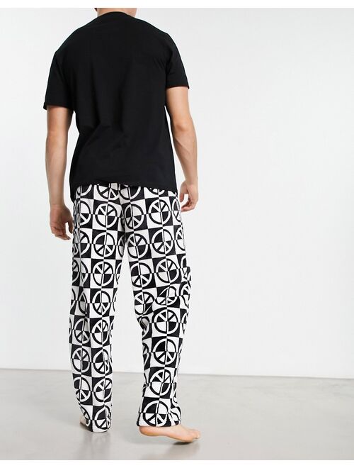 ASOS DESIGN pajama set with t-shirt and pants in black with fleece printed bottom