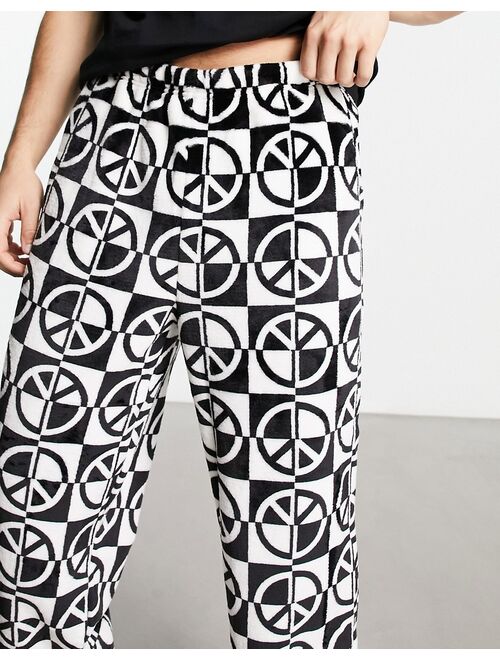 ASOS DESIGN pajama set with t-shirt and pants in black with fleece printed bottom