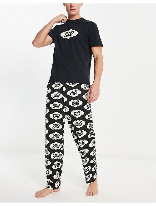 ASOS DESIGN pajama set in black with t-shirt and pants in sleepy print