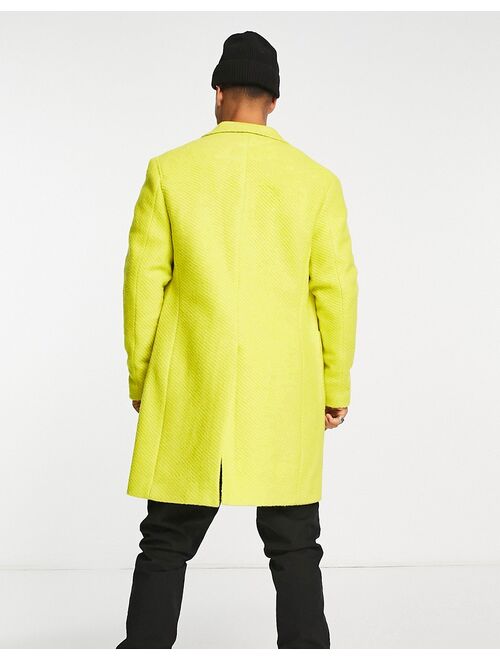 Devils Advocate longline coat in yellow