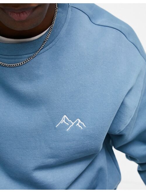 New Look mountain embroidered sweatshirt in mid blue