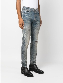 slim-fit illustration print jeans