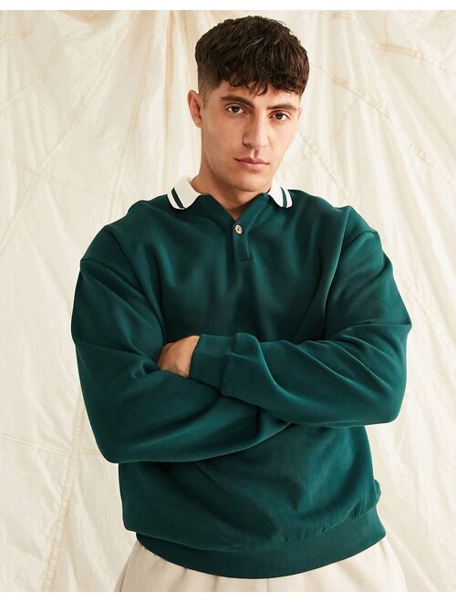 ASOS DESIGN oversized rugby polo sweatshirt with tipping in green