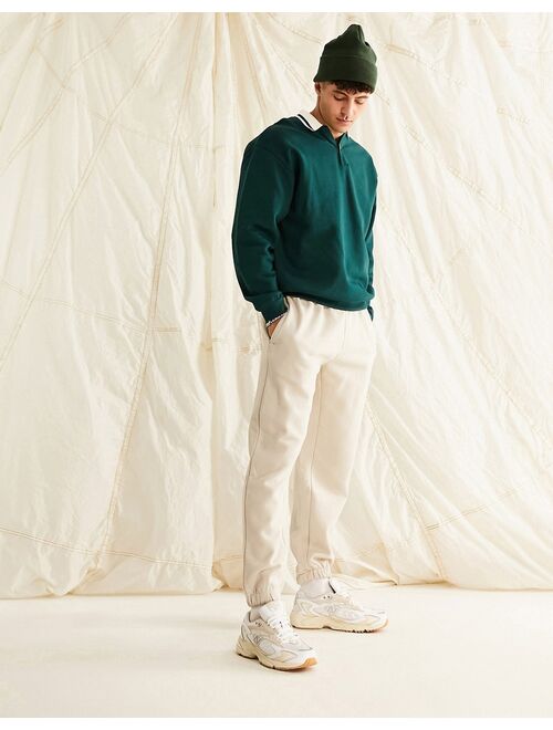 ASOS DESIGN oversized rugby polo sweatshirt with tipping in green