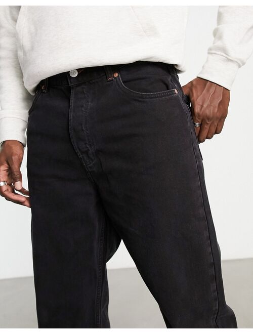 Weekday tape loose tapered jeans in black lux