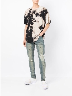 paint-splattered distressed jeans