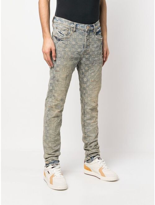 Purple Brand all-over logo-pattern denim jeans