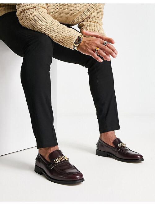 ASOS DESIGN loafers in burgundy faux leather with gold brooch detail