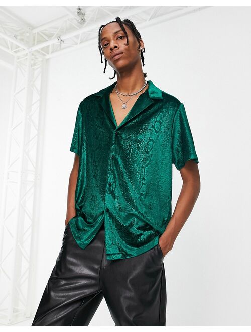 ASOS DESIGN relaxed velvet shirt with embossed snake print in green