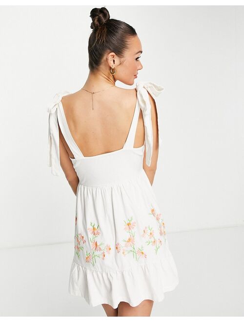 ASOS DESIGN cup detail sundress with tie shoulders with cream and coral floral embroidery