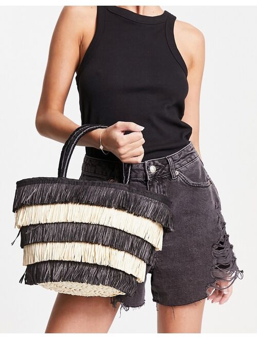 ASOS DESIGN tote bag in straw with black and natural fringe