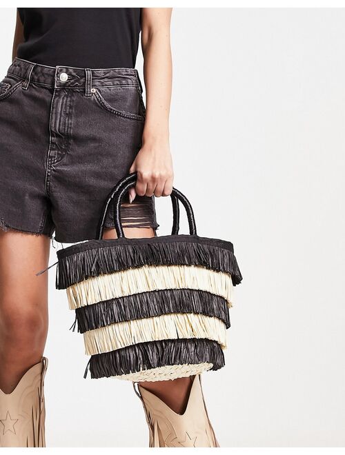 ASOS DESIGN tote bag in straw with black and natural fringe