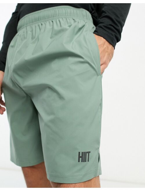 HIIT mid length training shorts in sage