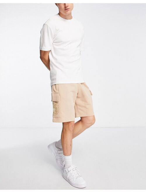 adidas Originals Graphics Ozworld cargo shorts in magic beige