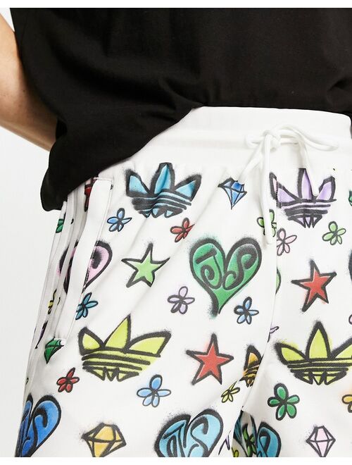 adidas Originals x Jeremy Scott 10 inch shorts in white and multi