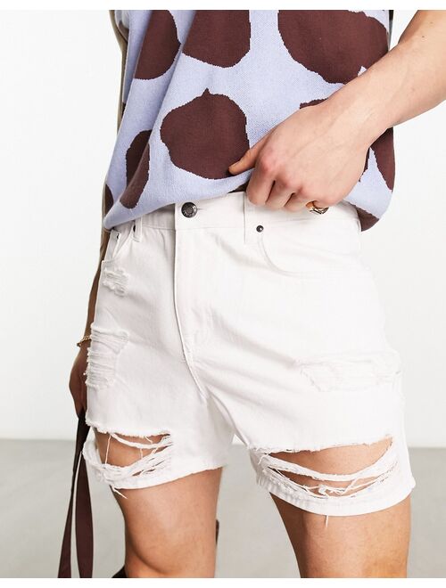 ASOS DESIGN shorter length denim shorts with rips in white