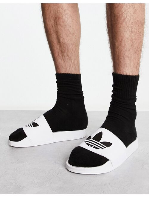 adidas Originals Adilette sliders in white