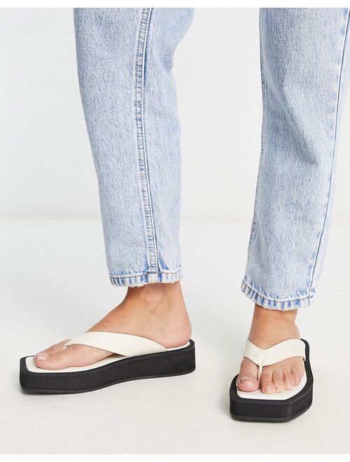 Monki faux leather thong sandals in black and white