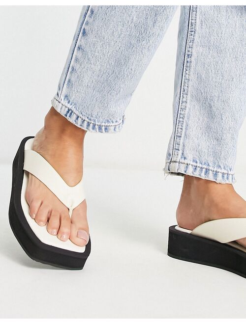 Monki faux leather thong sandals in black and white