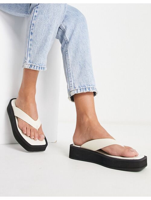 Monki faux leather thong sandals in black and white