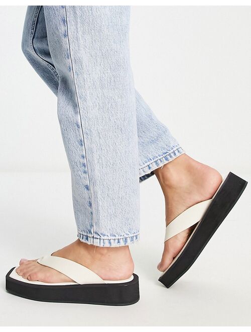 Monki faux leather thong sandals in black and white