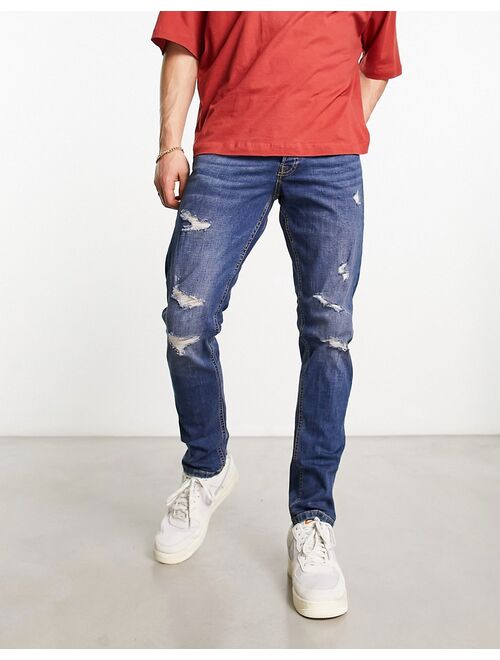 Jack & Jones Intelligence glenn slim fit jean in mid blue wash with abrasions