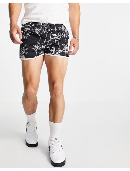 Jack & Jones Intelligence racer swim shorts in black palm print