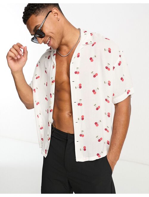 ADPT oversized revere collar short sleeve shirt in cherry print in white