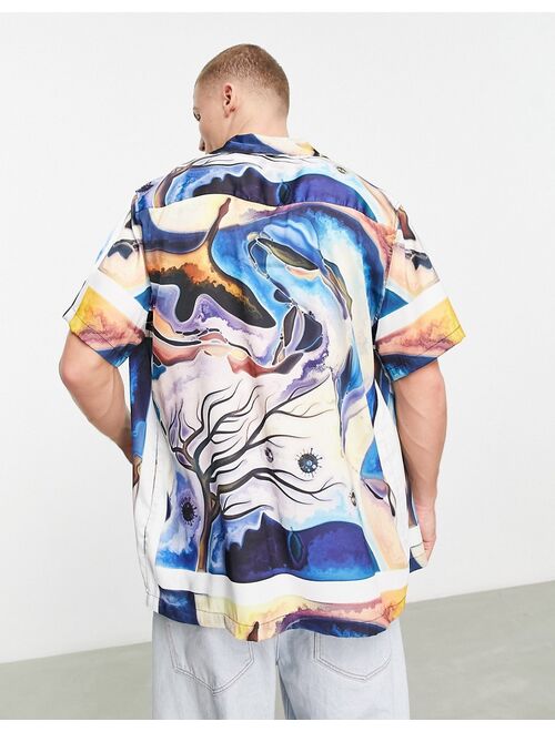 ASOS DESIGN relaxed camp collar satin shirt in abstract print