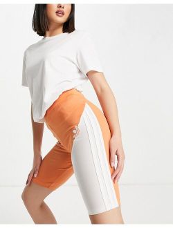 sliced trefoil legging shorts in white and hazy copper