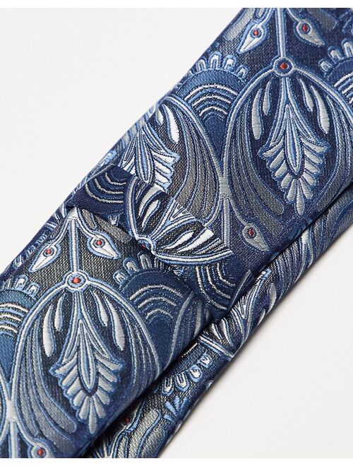 Twisted Tailor tie in blue with peacock design