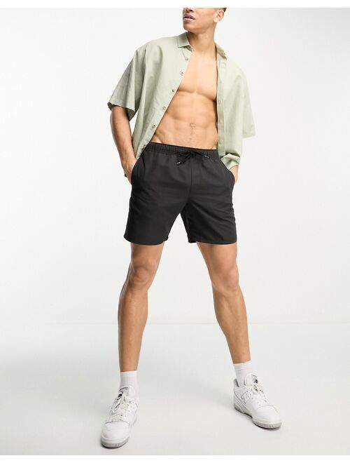 ASOS DESIGN swim shorts in mid length in black