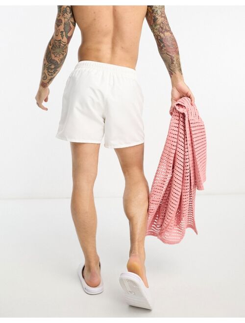 ASOS DESIGN swim shorts in short length in white