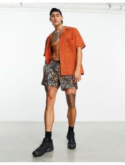 swim shorts in short length in leopard print