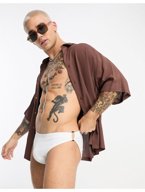 ASOS DESIGN swim trunks with gold hardware in white