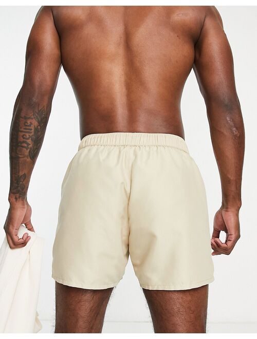 ASOS DESIGN swim shorts in short length in beige