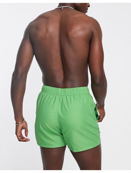 ASOS DESIGN swim shorts in short length in green