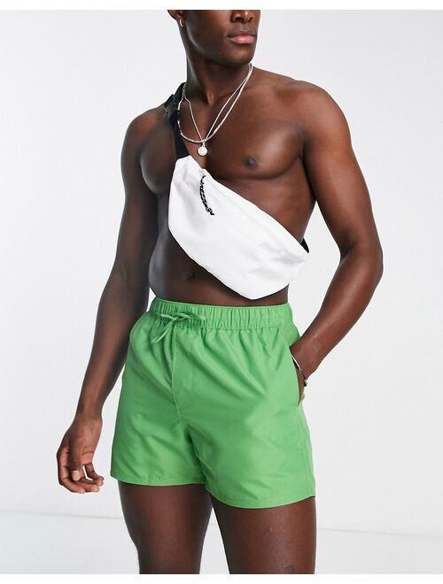 ASOS DESIGN swim shorts in short length in green