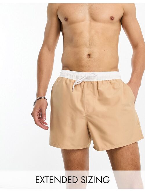 ASOS DESIGN swim shorts in short length with contrast waistband in beige