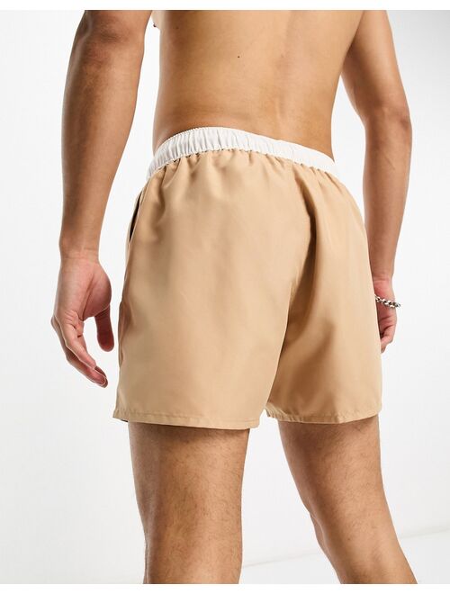 ASOS DESIGN swim shorts in short length with contrast waistband in beige