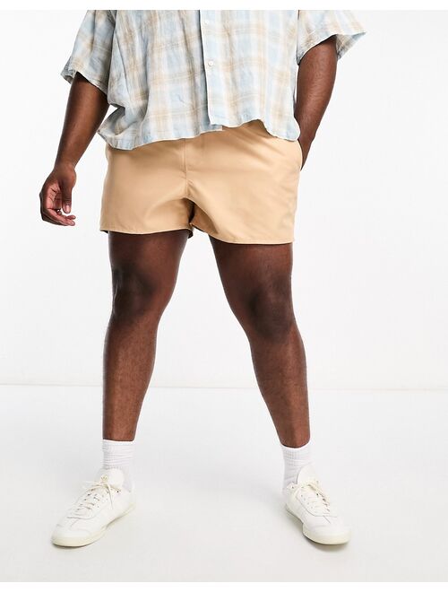 ASOS DESIGN swim shorts in short length with contrast waistband in beige