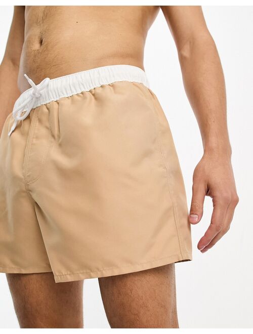 ASOS DESIGN swim shorts in short length with contrast waistband in beige