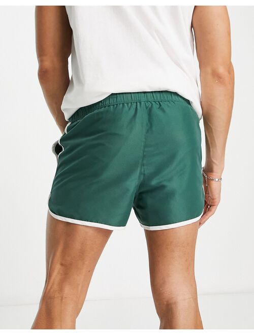 ASOS DESIGN runner swim shorts in super short length with placement print in khaki